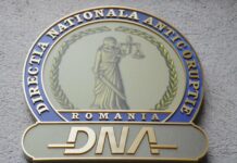 Lector universitar, reținut de procurorii DNA pentru luare de mită
